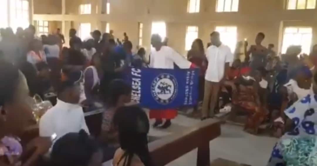 Chelsea Fans Storm Church With Flag