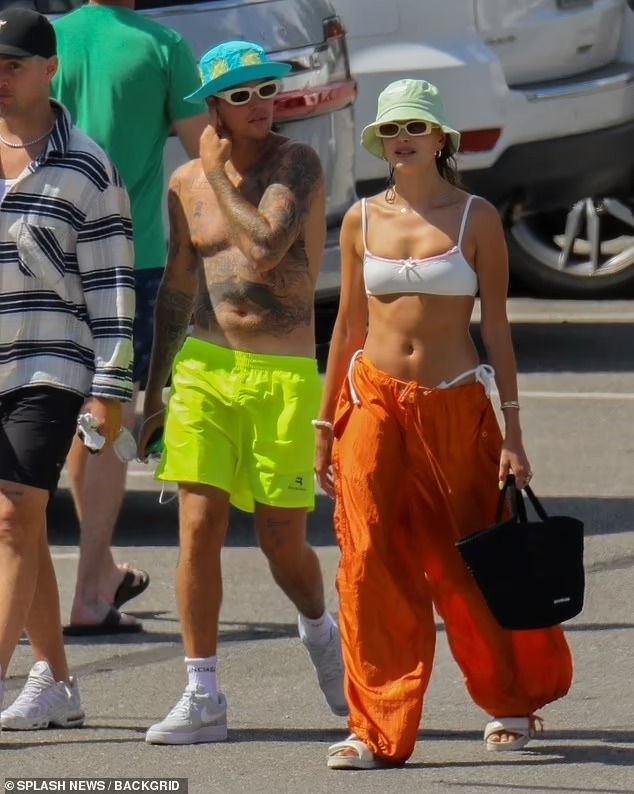 justin-bieber-and-his-wife-hailey-showcase-their-toned-bodies-as-they-splash-around-lake-coeur-dalene-in-idaho